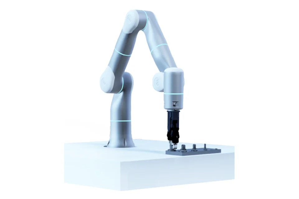 A robot arm fitting parts at a white workbench